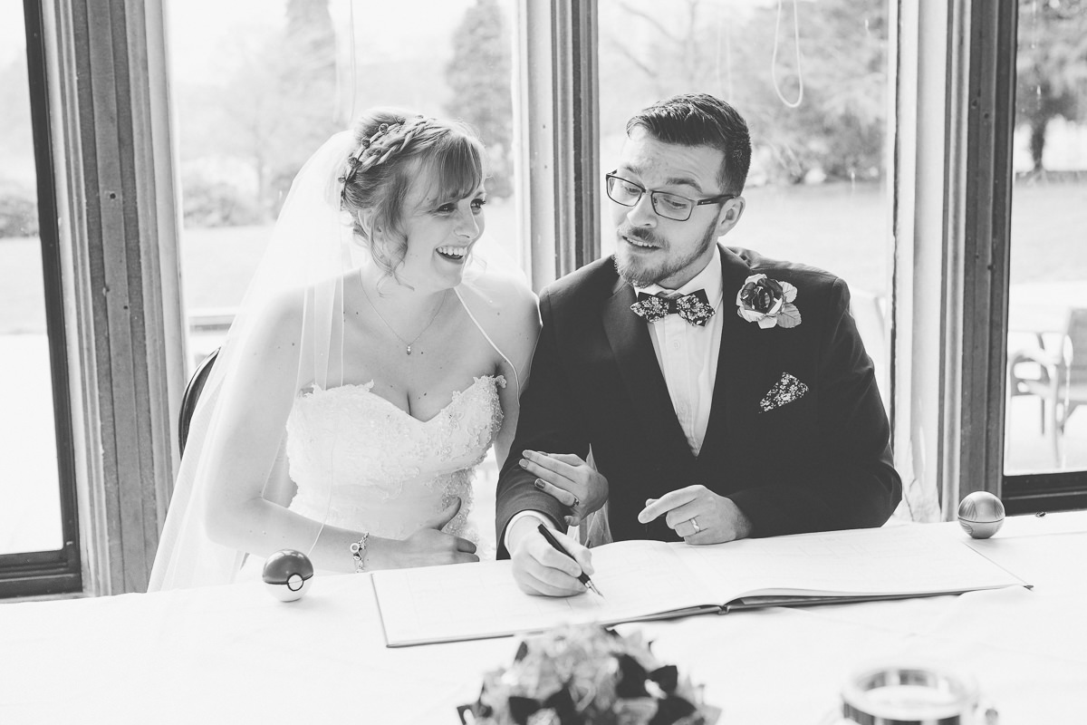 signing register at Wroxall Abbey wedding